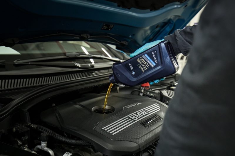Lima,,Peru;,March,2020:,Oil,Change,And,Preventive,Maintenance,Of Lima, Peru; March 2020: oil change and preventive maintenance of a European BMW car